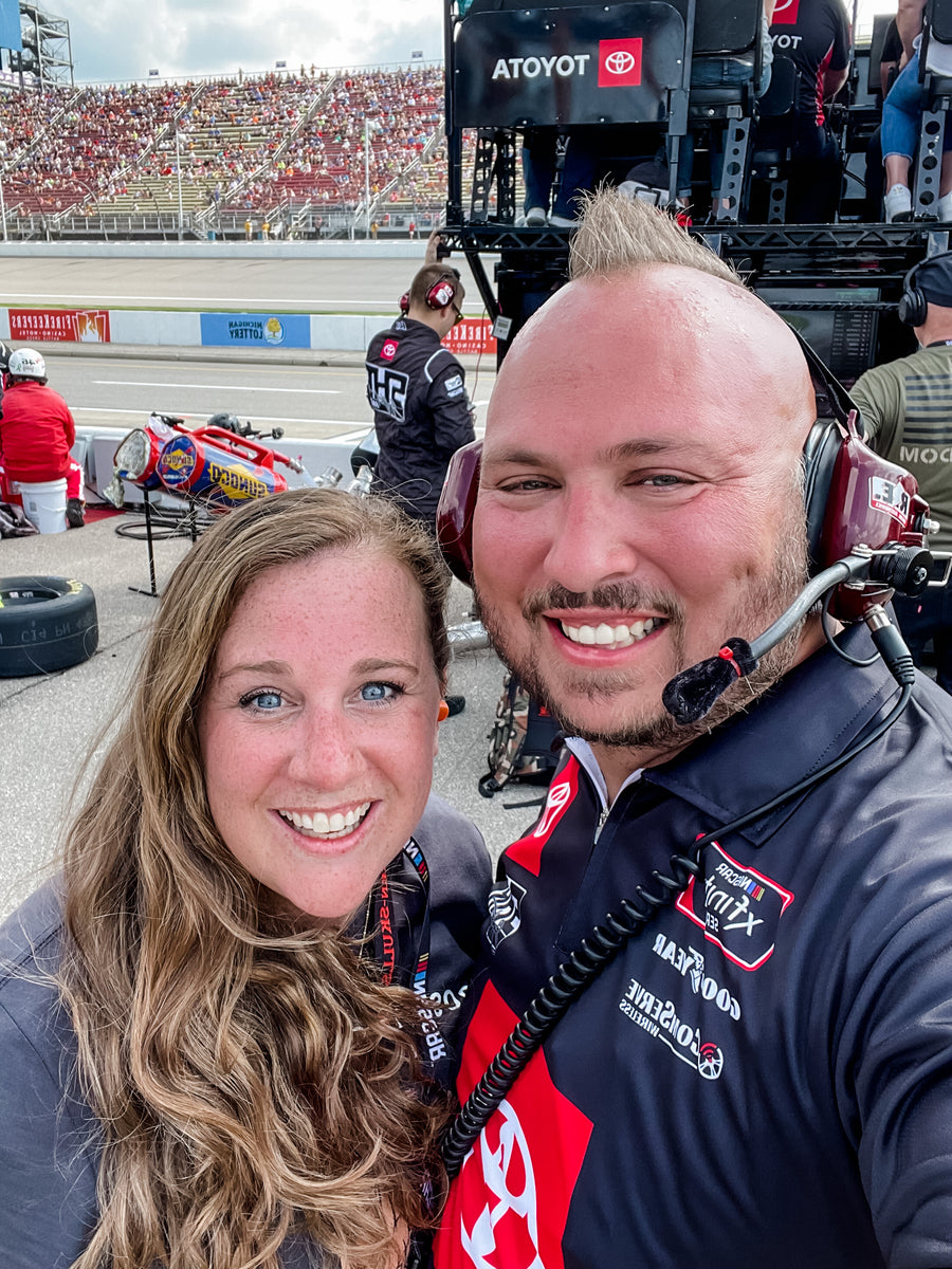 Mohawk Matt and Lindy Denny at Michigan International Speedway cheering on Colin Garrett and Sam Hunt Racing Nascar Xfinity car No. 26 from the pit. #NewHolland250